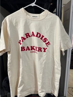 madhappy Paradise Bakery Aspen Collab Tee in Cream with Red Print BNWT